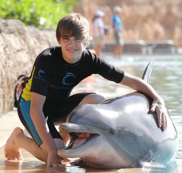 gyjuyhjk.jpg Justin with a dolphin image by jonas_brothers1824