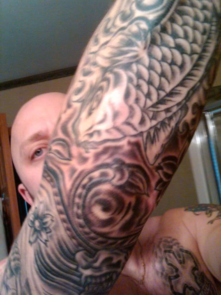 Hayna mask on right bicep